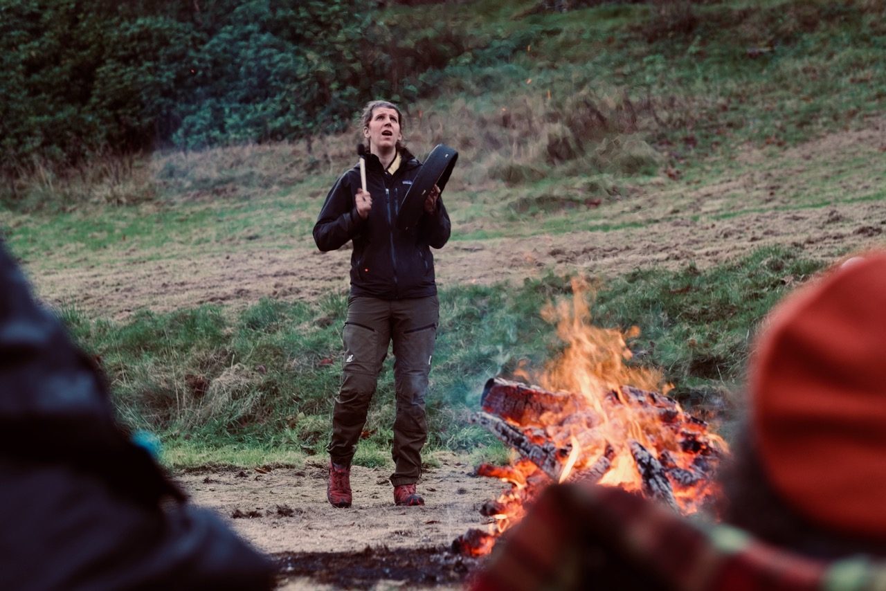 Shamanic drumming by the fire at Torus Tree firewalk ceremony