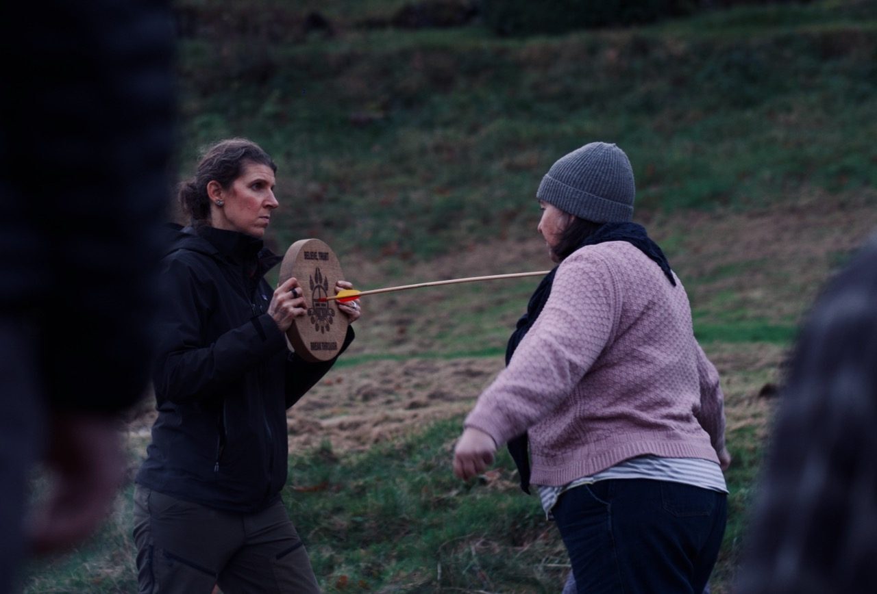 Arrow break exercise at Torus Tree firewalk — challenging limiting beliefs